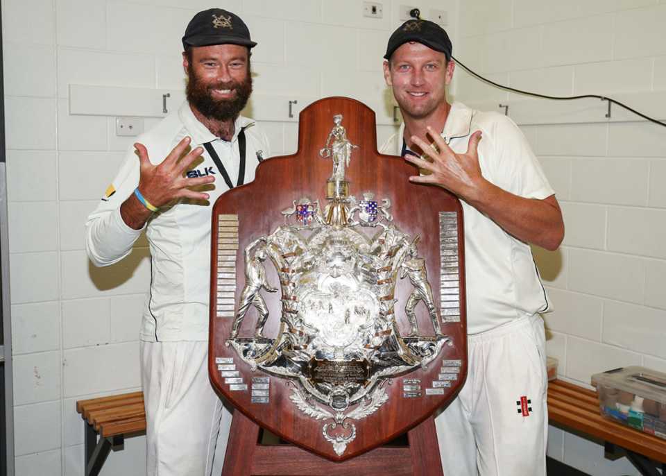 Rob Quiney (left) and Cameron White pose with the Shield