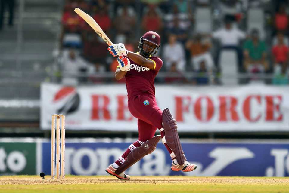 Evin Lewis swivels to reach the backward square-leg fence