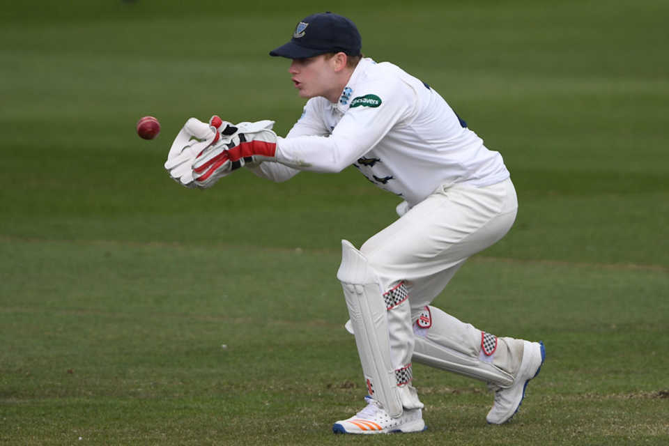 Sussex wicketkeeper Ben Brown collects a ball