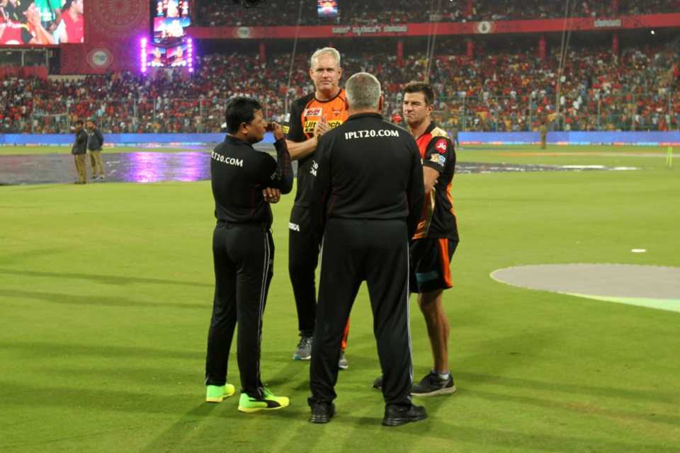 Sunrisers Hyderabad coach Tom Moody and assistant coach Simon Helmot speak to the umpires