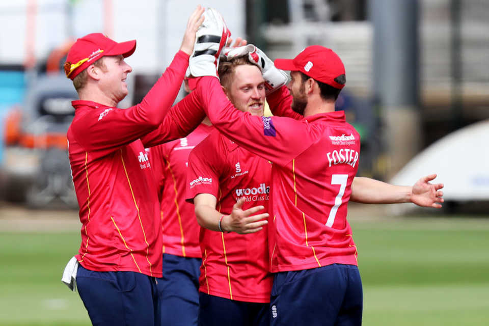 Jamie Porter is congratulated after dismissing Dawid Malan