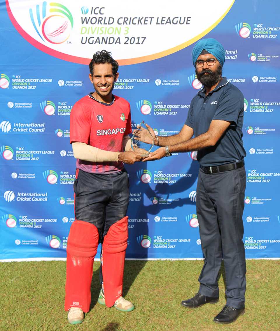 Arjun Mutreja accepts the Man of the Match award from ICC official Gurjit Singh