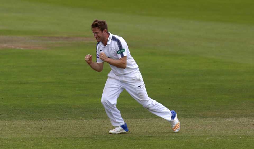 Liam Dawson celebrates one of his four wickets