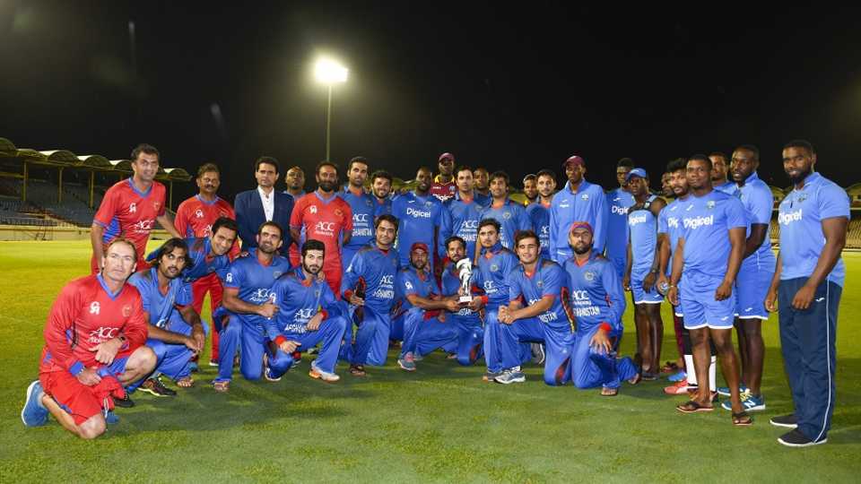 West Indies and Afghanistan players pose for a photograph after the third ODI was washed out