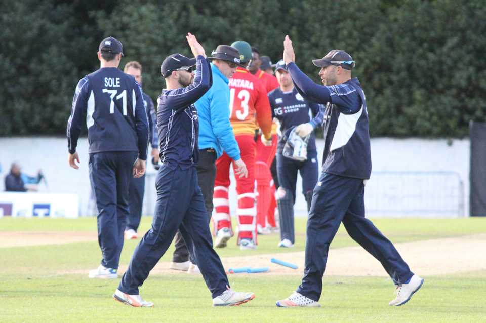 Preston Mommsen and captain Kyle Coetzer celebrate Scotland's first ODI win over a Full Member