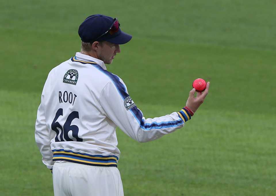 Joe Root inspects the pink ball, Yorkshire v Surrey, Specsavers County Championship Division One, Headingley, 2nd day, June 27, 2017