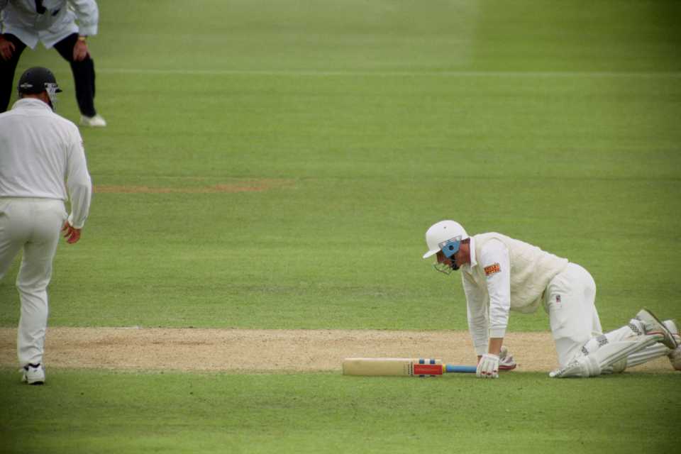 Mike Atherton is on his knees after being run out for 99