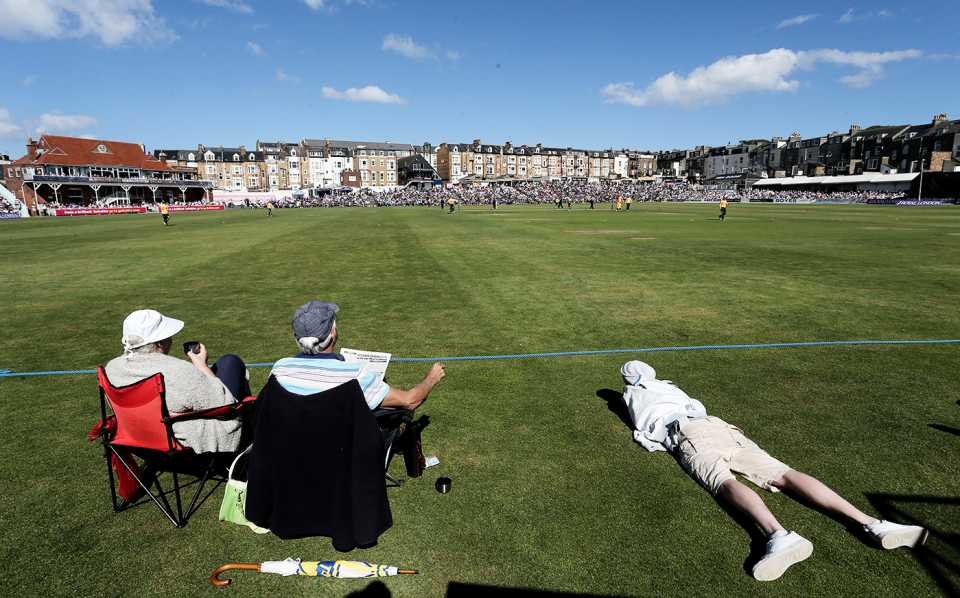 Spectators relax at the boundary in Scarborough