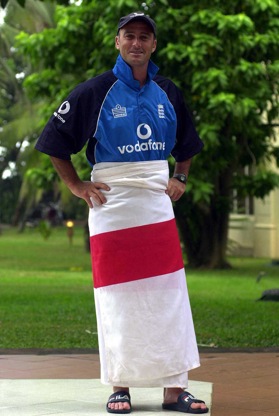 Graham Thorpe wraps an England flag around him like a sarong after being named captain for the one-day series in Sri Lanka