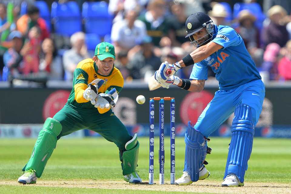 Virat Kohli cuts the ball as AB de Villiers looks on, India v South Africa, Champions Trophy, Group B, Cardiff, June 6, 2013