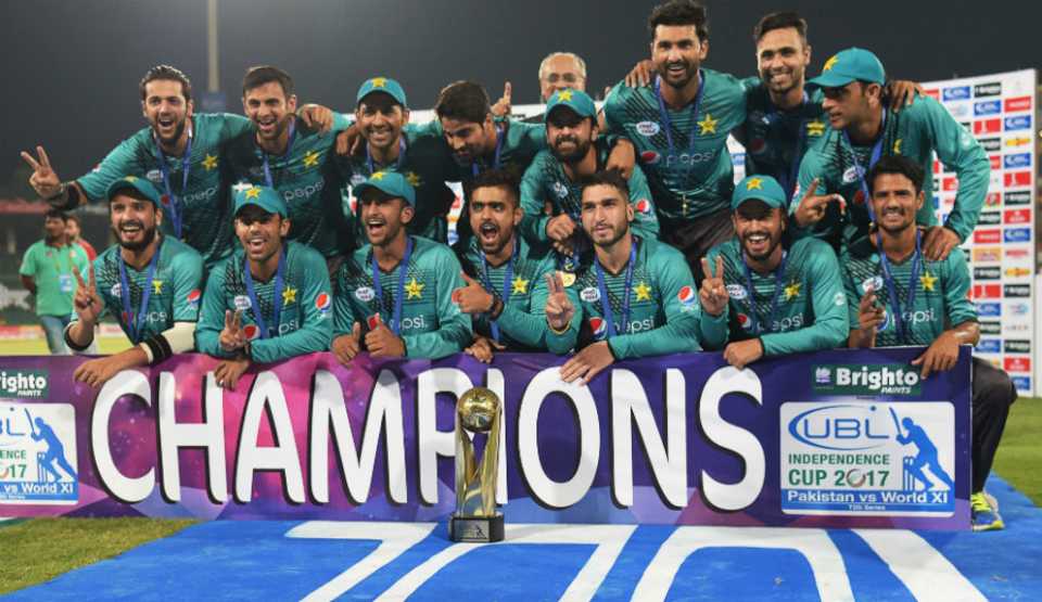 Members of the Pakistan team pose with the Independence Cup