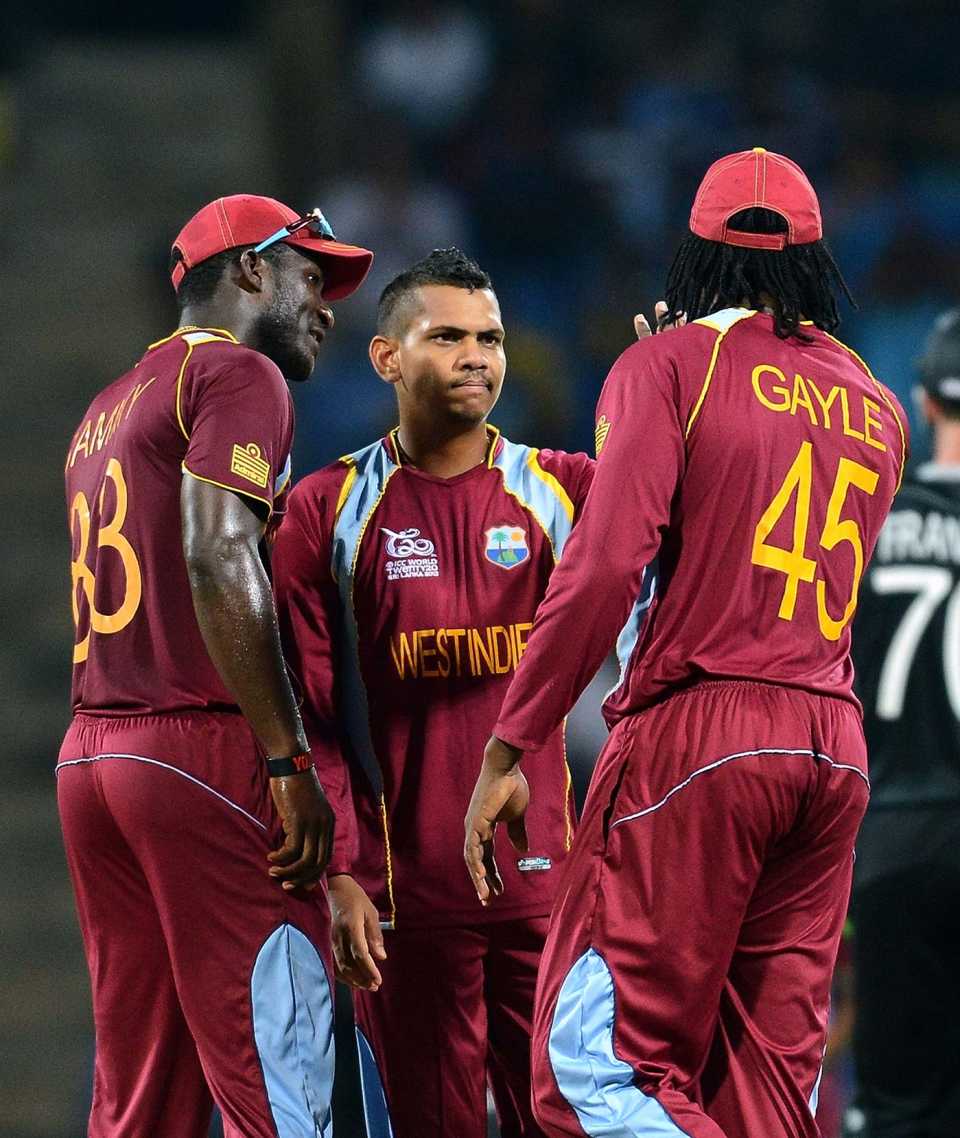 Sunil Narine celebrates a wicket with Chris Gayle and Darren Sammy