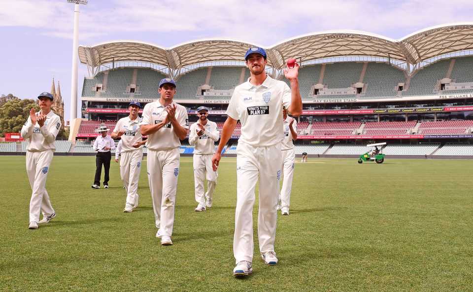 Mitchell Starc walks back to the pavilion after bagging a match haul of 10 wickets