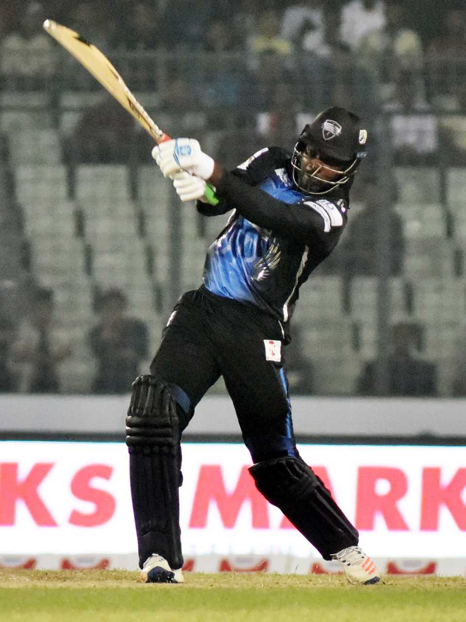 Chris Gayle launches into a big shot