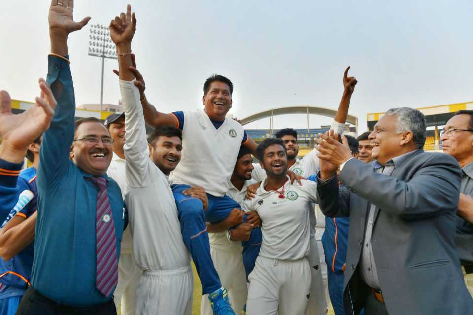 Vidarbha players hoist their head coach Chandrakant Pandit on their shoulders after historic Ranji triumph, January 1, 2018