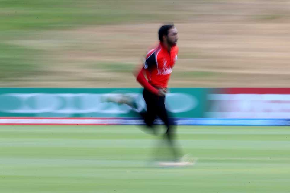 Faisal Jamkhandi runs in to bowl