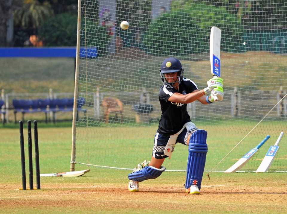 Harmanpreet Kaur bunts one away during a nets session
