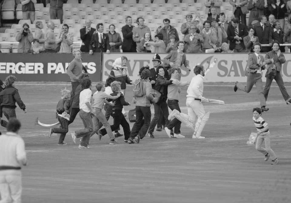 Ian Botham is mobbed by young fans as he runs off the field, England v Australia, 3rd Test, Headingley, 4th day, July 20, 1981