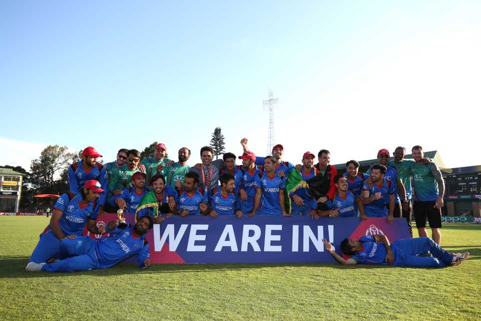 Afghanistan's players pose for photographs after sealing their place at the 2019 World Cup