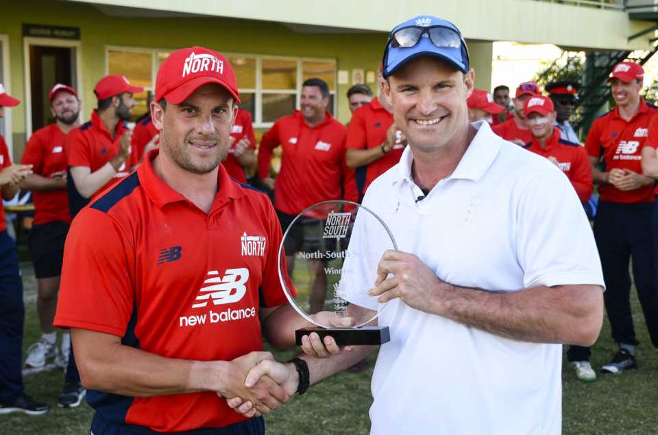 North captain Steve Mullaney receives the trophy from Andrew Strauss