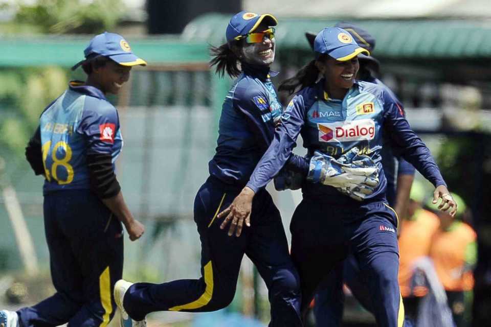 The Sri Lanka players celebrate a wicket