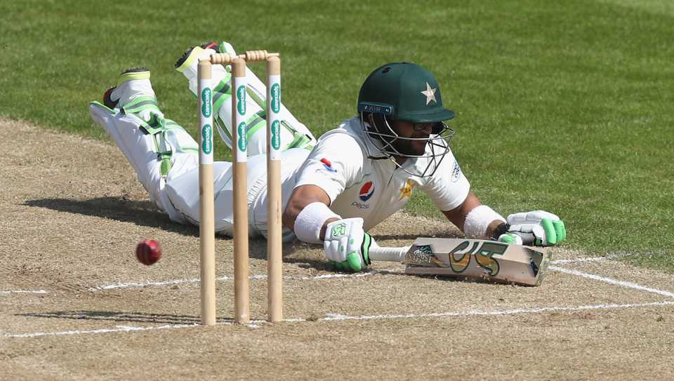 Imam-ul-Haq puts in a dive to make his ground
