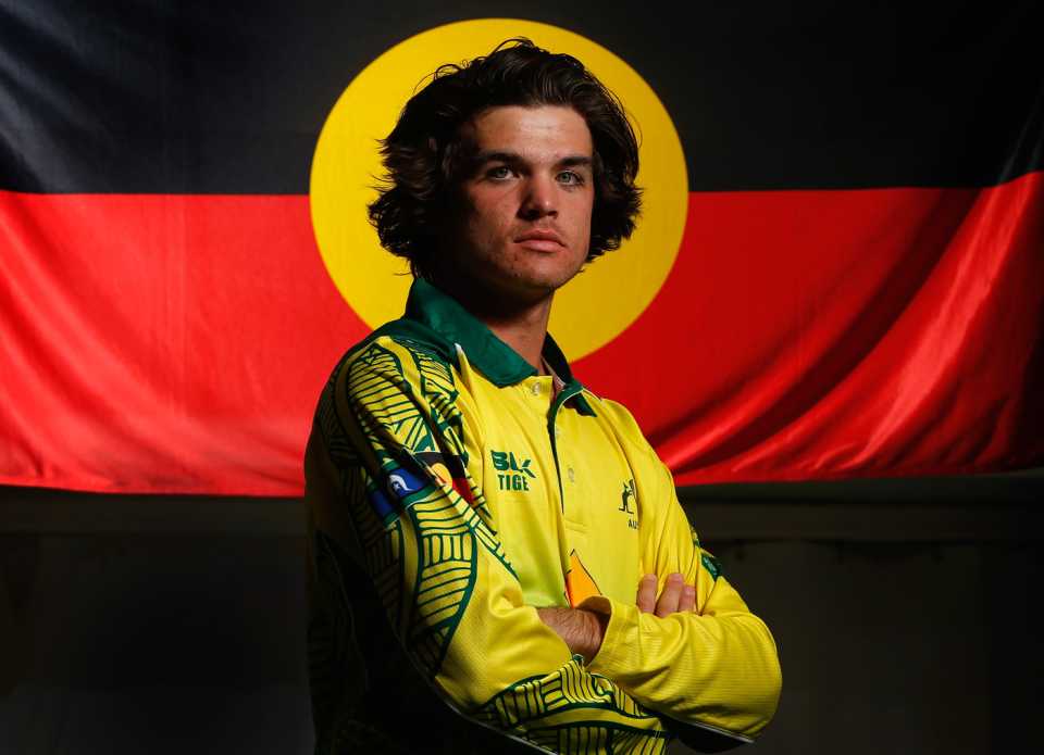 Brock Larance strikes a pose with the Australian Aboriginal flag in the background, Australian Indigenous men cricket team's tour of England, June 5, 2018
