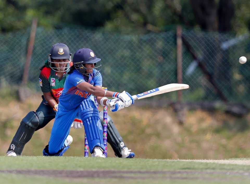 Harmanpreet Kaur sweeps the ball away