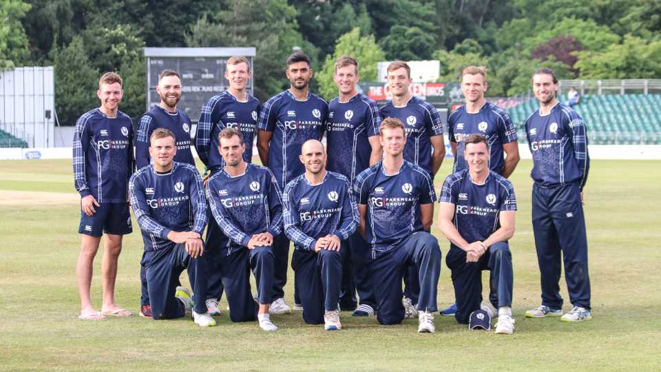 Scotland's squad poses for a celebratory photo after a historic win
