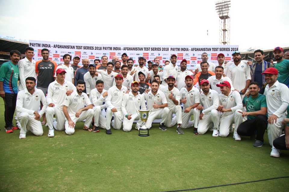 India and Afghanistan pose together with the trophy