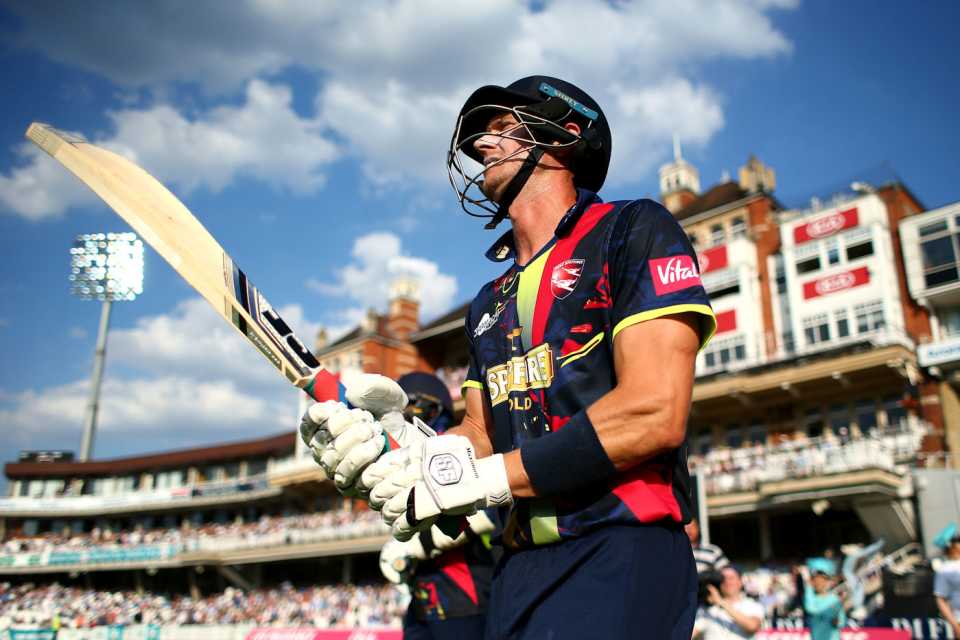 Joe Denly walks out in front of a full house at Kia Oval