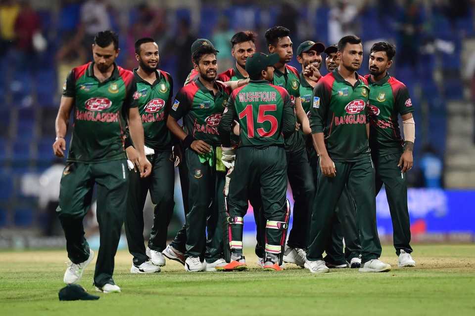 The Bangladesh team celebrate after a tense win against Afghanistan