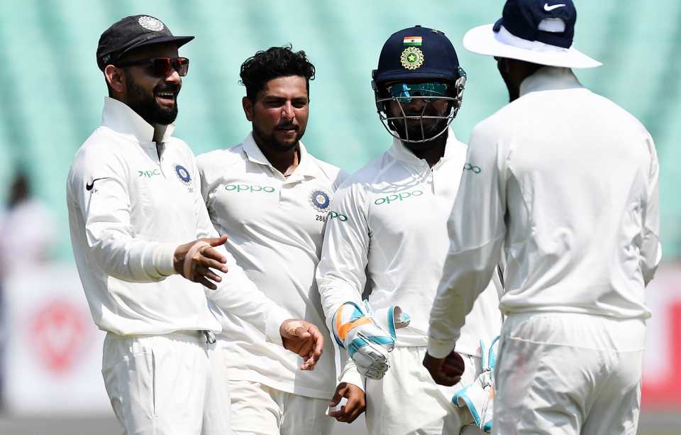 Virat Kohli, Rishabh Pant and Kuldeep Yadav celebrate a wicket
