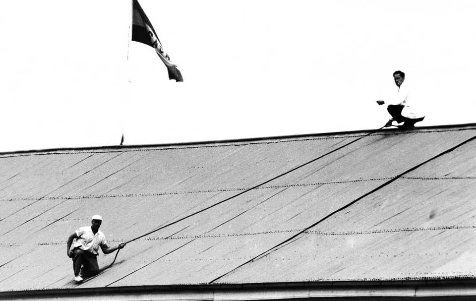 Groundsmen at the Adelaide Oval use a rope to retrieve the ball from the roof after Ted Dexter placed it there with a big six, South Australia v MCC, Adelaide, December 27, 1962
