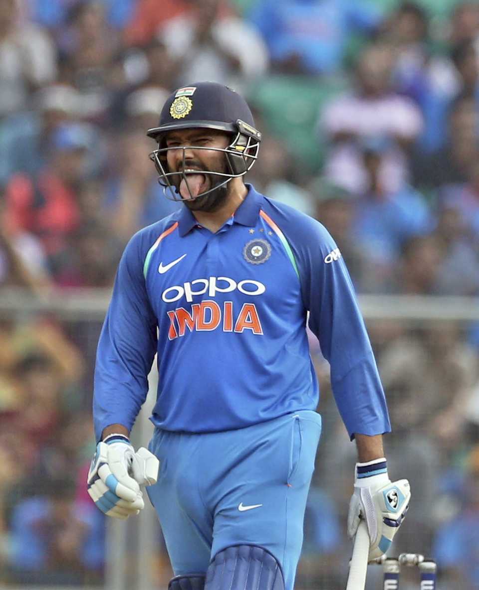 Rohit Sharma reacts after hitting a boundary