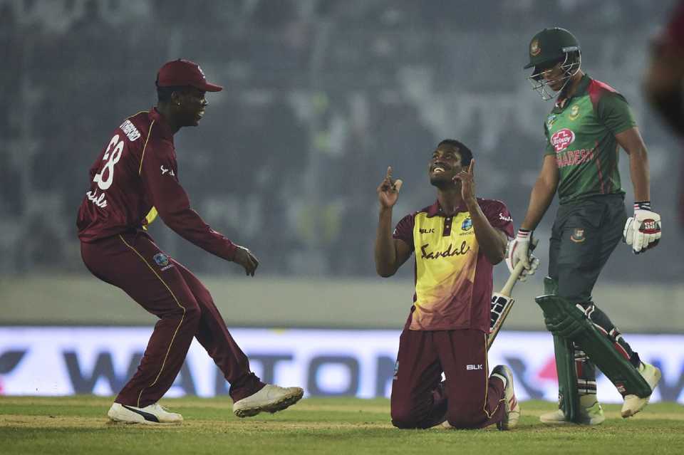 Keemo Paul kneels down in celebration after completing his five-wicket haul
