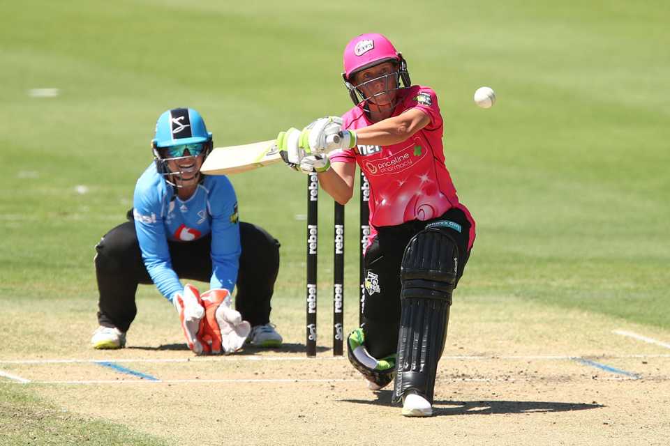 Alyssa Healy shapes to the leg side during her century