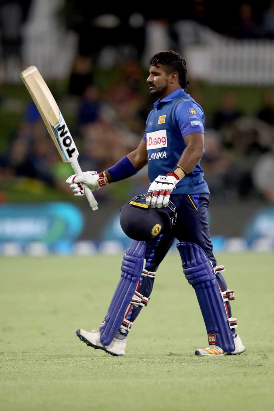 Kusal Perera raises his bat while walking off after a fine century, New Zealand v Sri Lanka, 1st ODI, Mount Maunganui, January 3, 2019