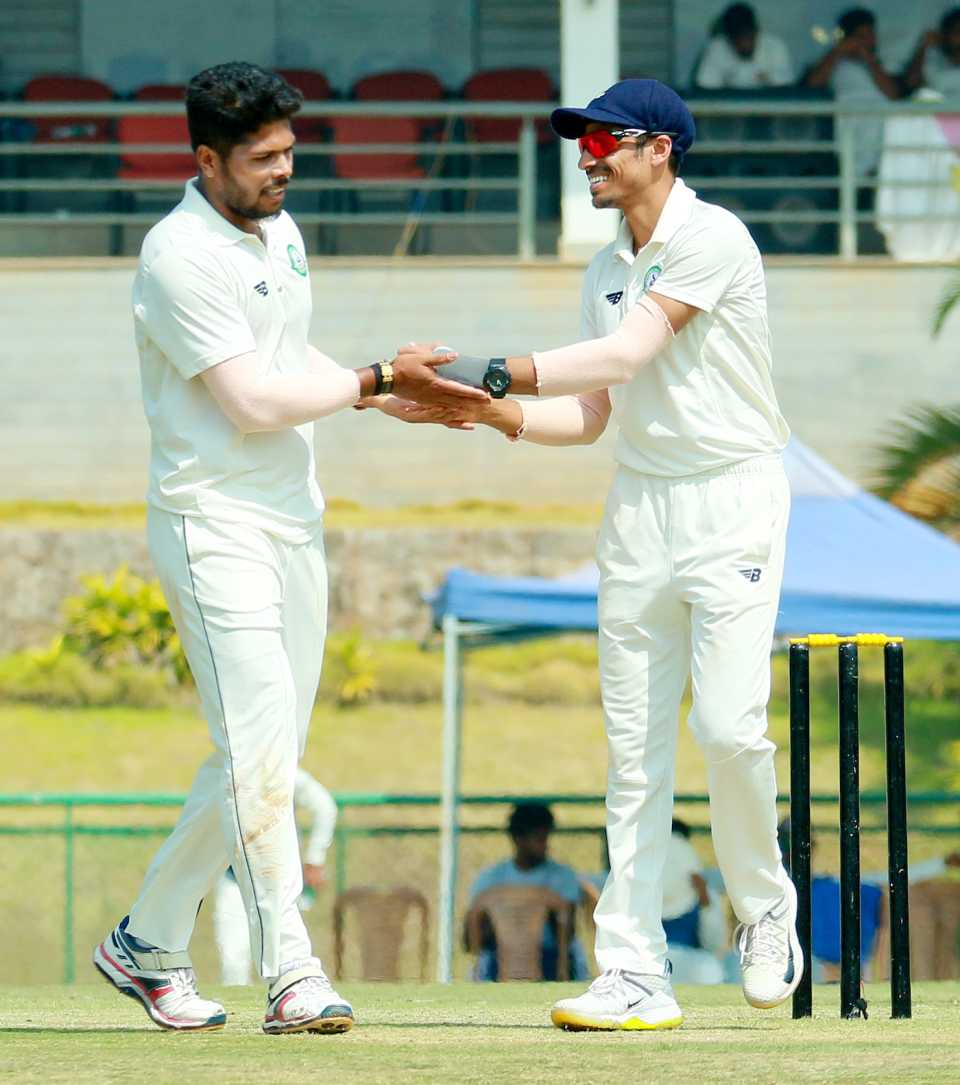 Umesh Yadav is congratulated after one of his wickets