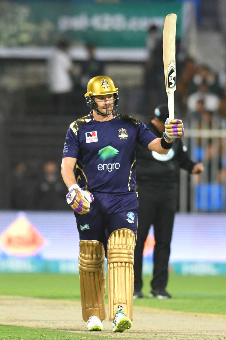 Shane Watson raises his bat after getting his fifty