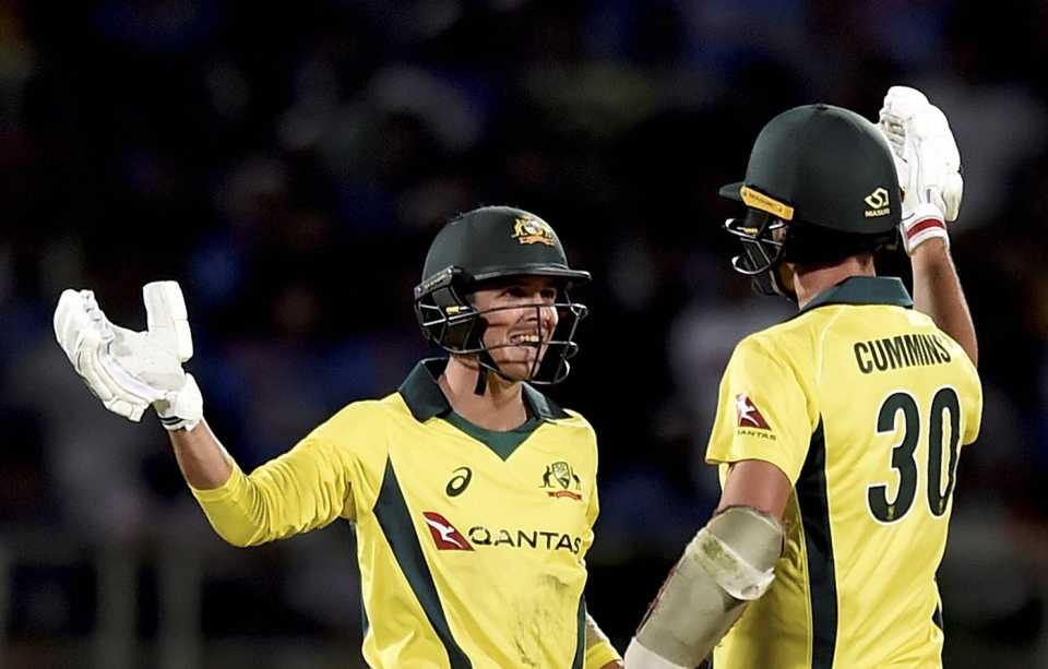 Pat Cummins celebrates with Jhye Richardson after hitting the winning runs in Vizag, India v Australia, 1st T20I, Visakhapatnam, February 24, 2019