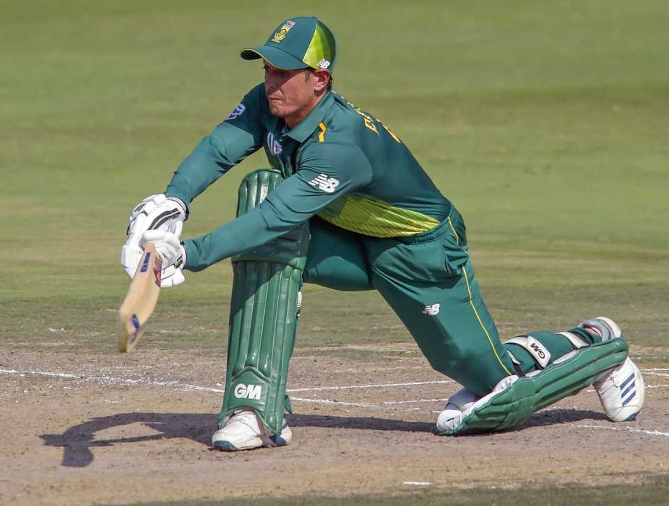 Quinton de Kock lunges forward to sweep