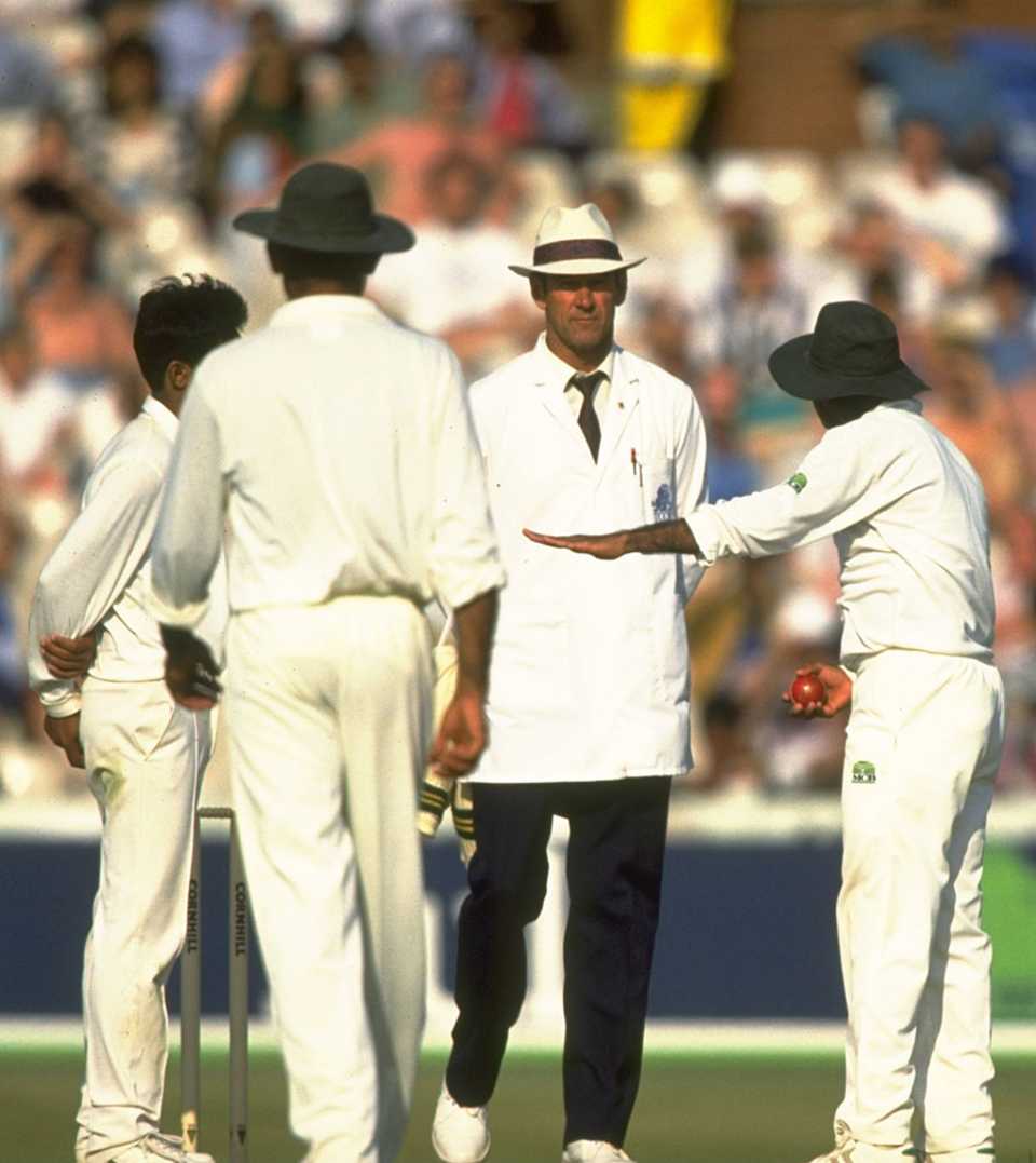 Pakistan's players arguing with umpire Roy Palmer after he warned Aaqib Javed for intimidatory bowling