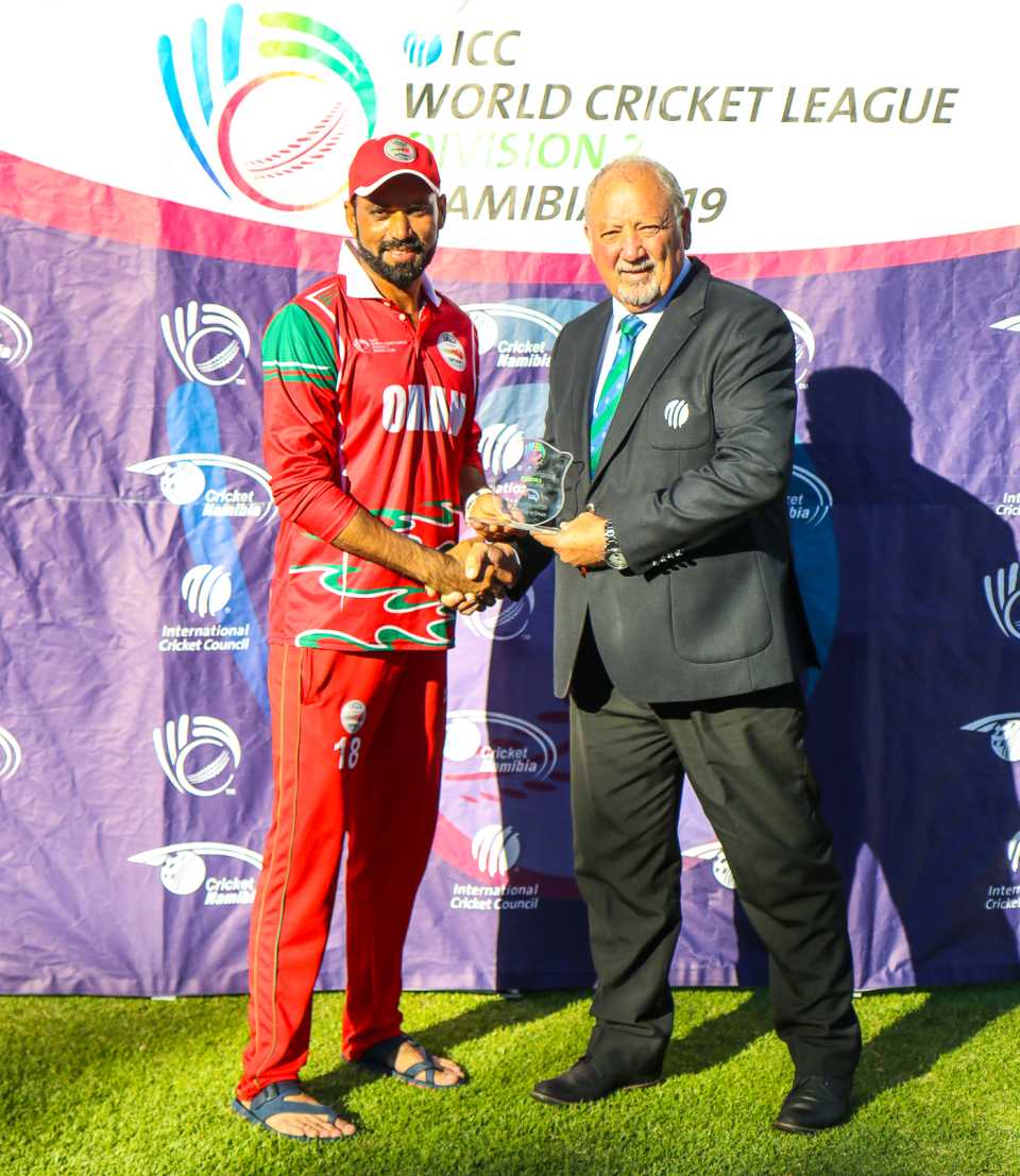 Bilal Khan accepts the Man of the Match award after his 4 for 30