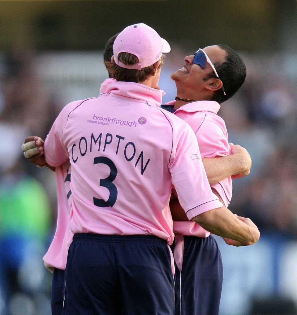 Murali Kartik and Nick Compton celebrate a wicket