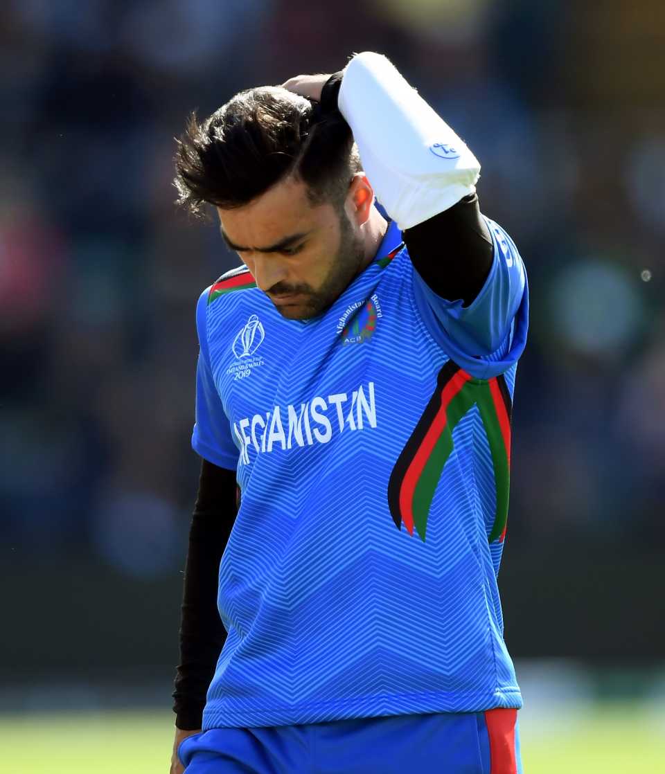 Rashid Khan rubs his head after copping a blow from Lockie Ferguson, Afghanistan v New Zealand, World Cup 2019, Taunton, June 8, 2019
