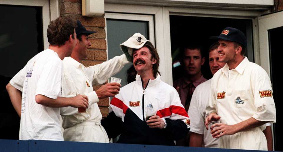 Mike Watkinson playfully takes Jack Russell's hat off during England's celebrations, England v West Indies, 4th Test, Old Trafford, 4th day, July 30, 1995