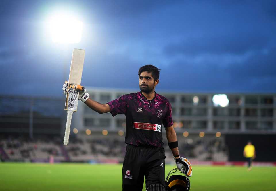 Babar Azam walks off after reaching his hundred from the final ball