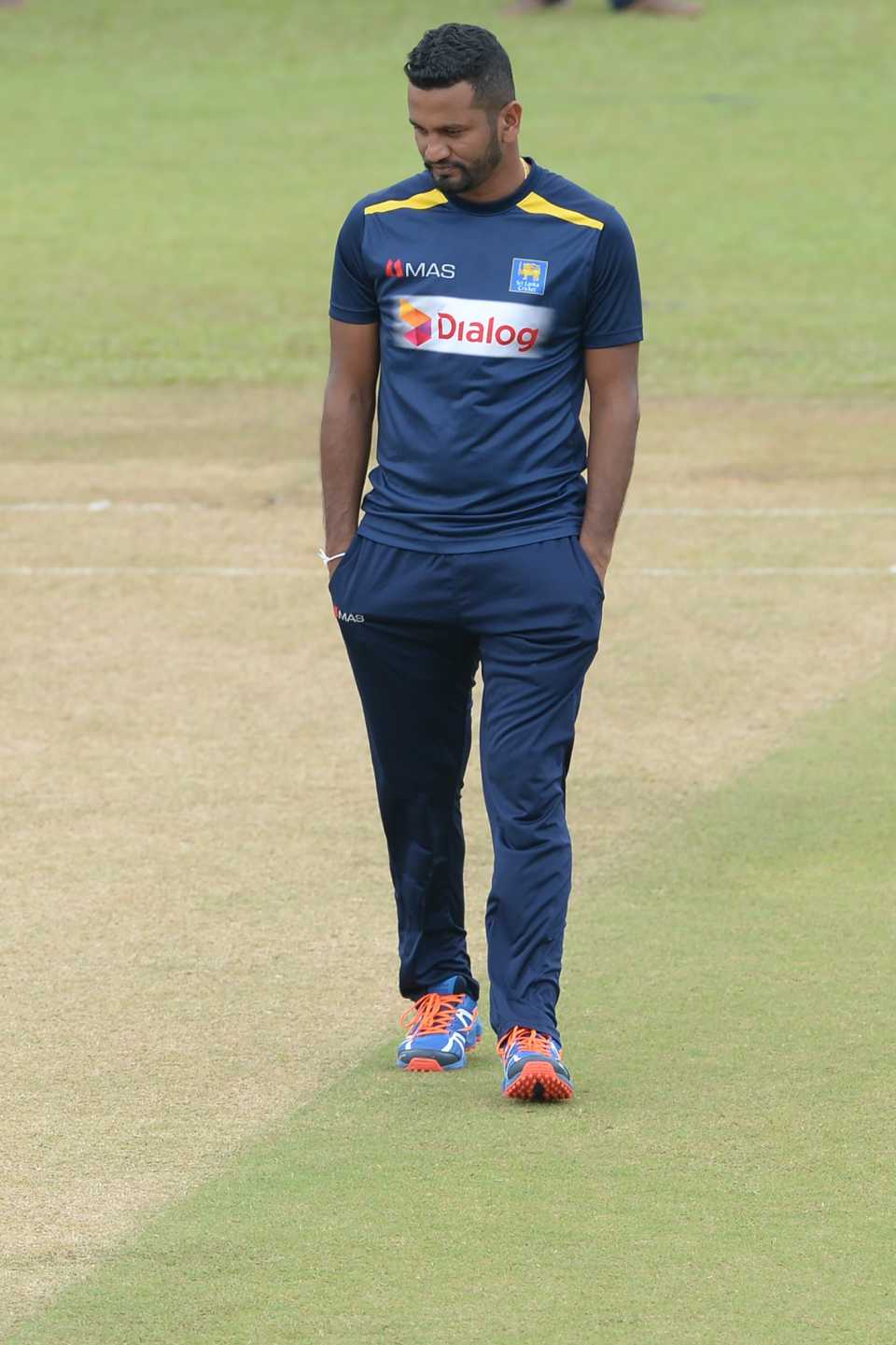 Dimuth Karunaratne has a look at the pitch