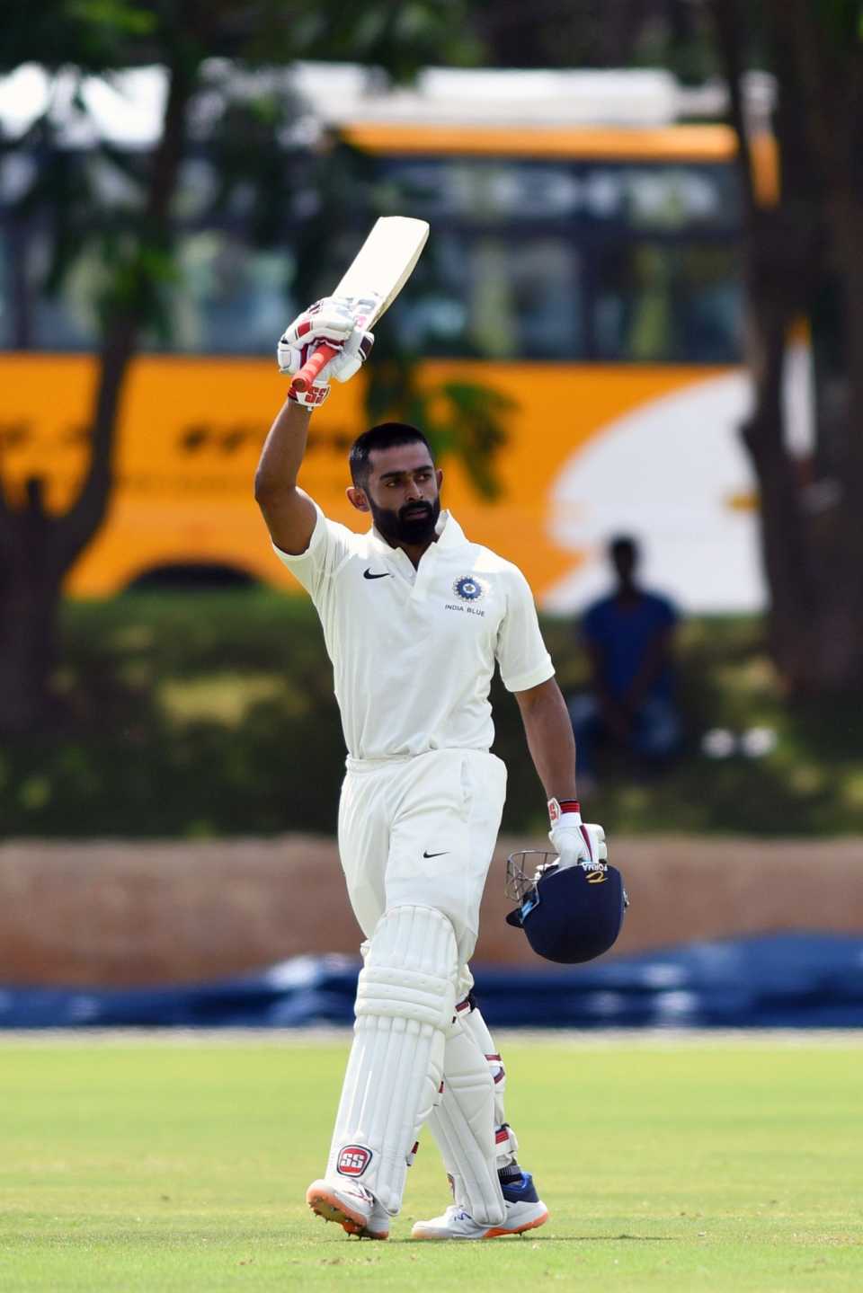 Ankit Bawne raises his bat after reaching a hundred, India Blue v India Red, Alur, 3rd day, August 25, 2019